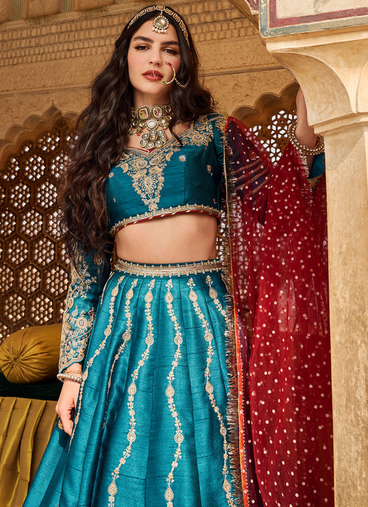 Woman in brightly colored traditional Indian dress with ethnic jewelry