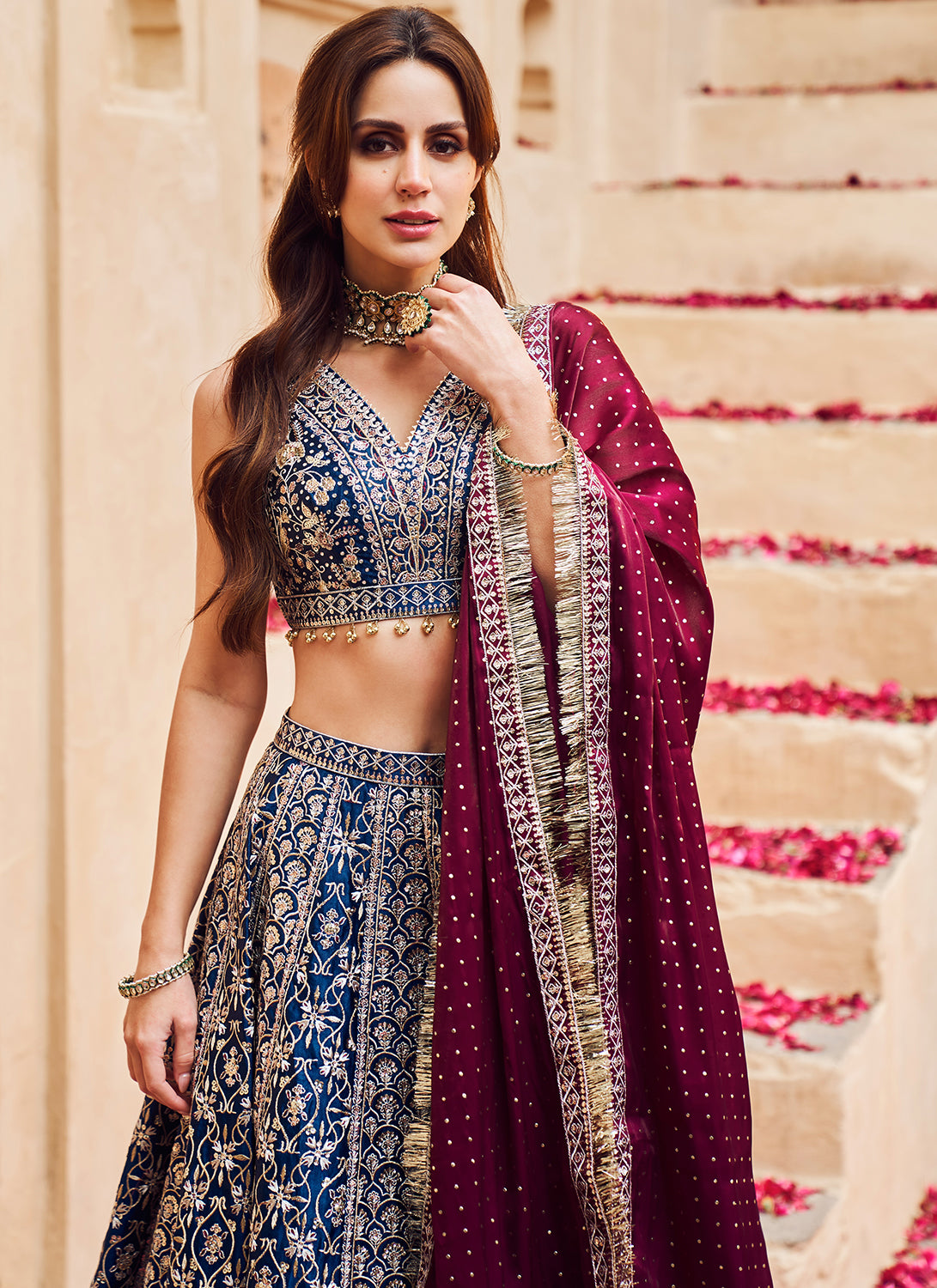 MAROON RED ZARI EMBROIDERED PATTERNED BRIDAL LEHENGA SET WITH COLOURED  MOTIFS PAIRED WITH A MATCHING EMBROIDERED DUPATTA AND ALL OVER  EMBELLISHMENTS. - Seasons India