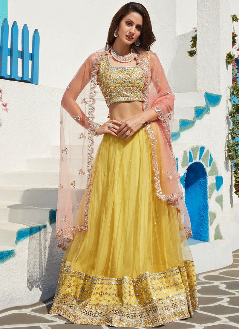 Yellow And Pink Georgette Chikankari Embellished Lehenga Set with Tassels |  lovelyweddingmall.com